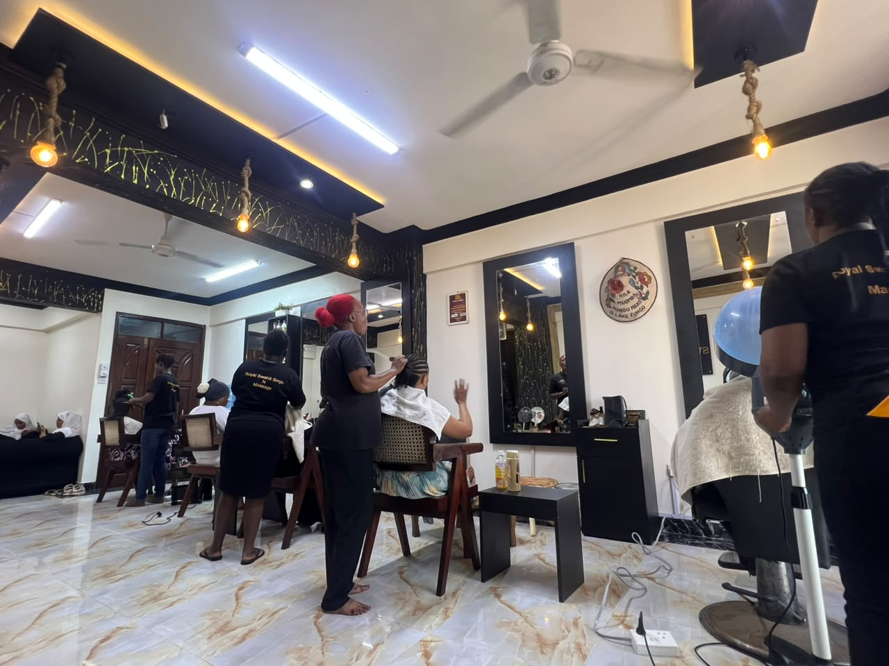 Salon team caring for guests inside Royal Swahili Singo N Massage